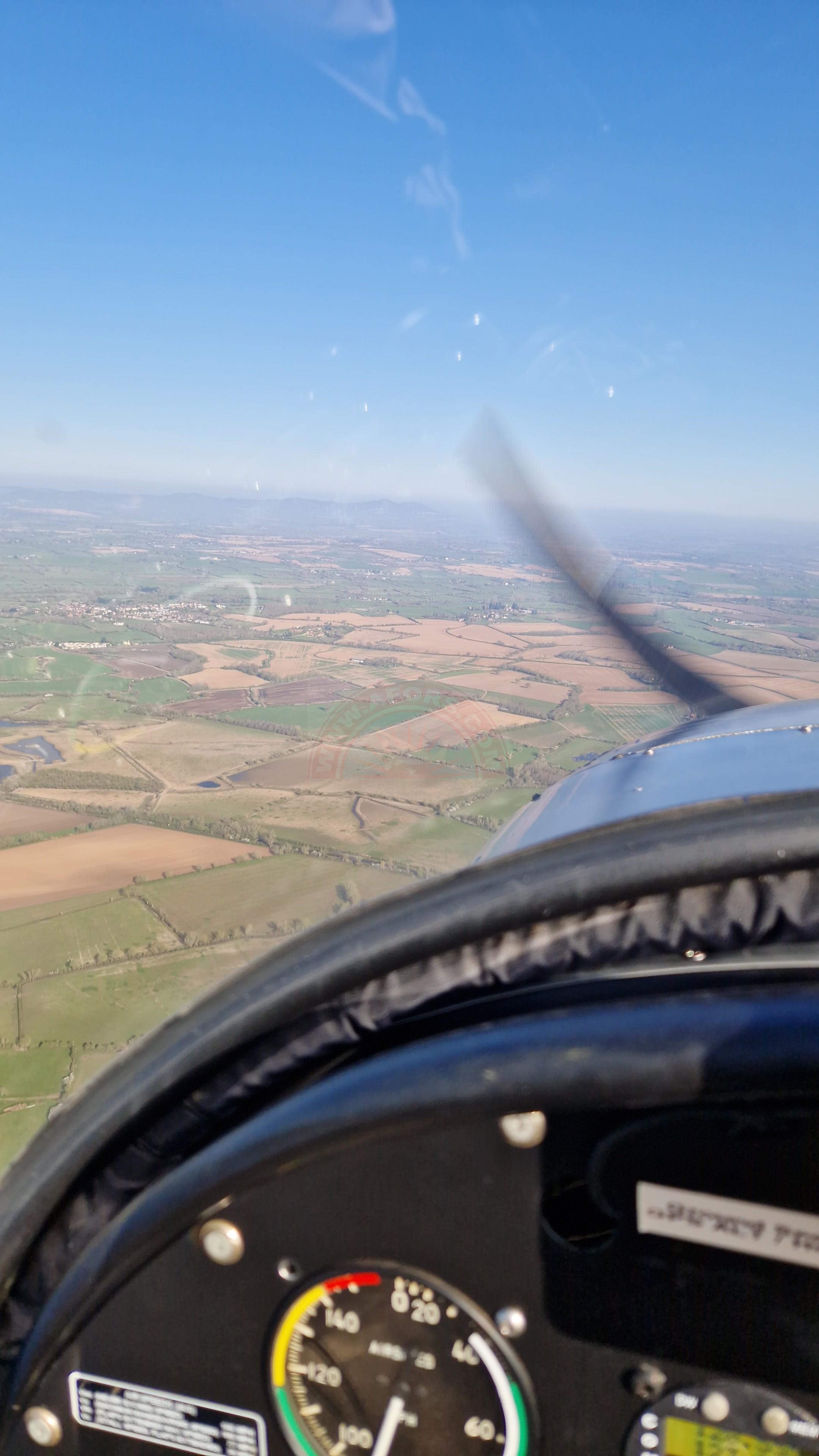 The sun shines on the mountains and trees (by Adam Kool on Unsplash)