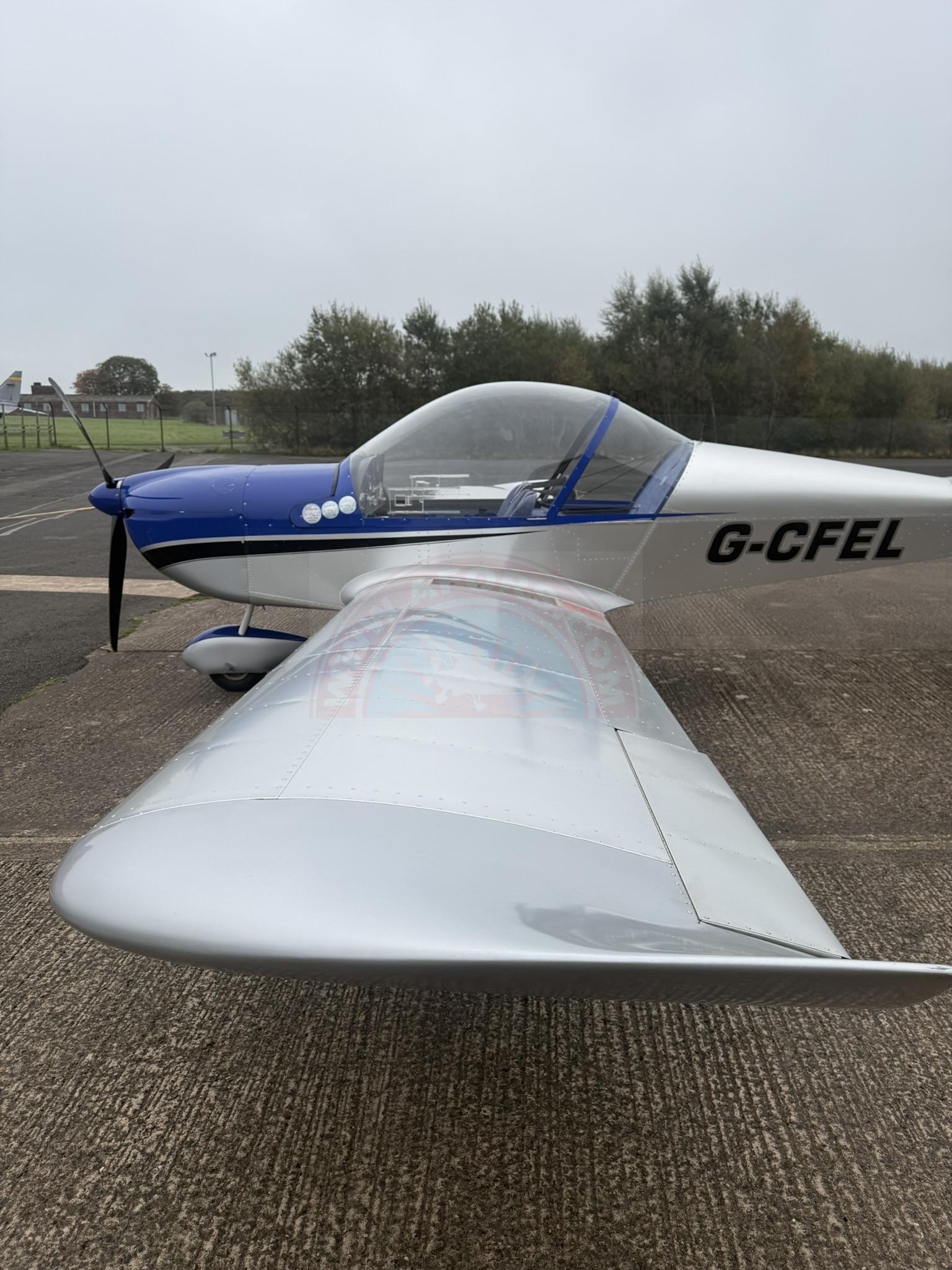 The sun shines on the mountains and trees (by Adam Kool on Unsplash)