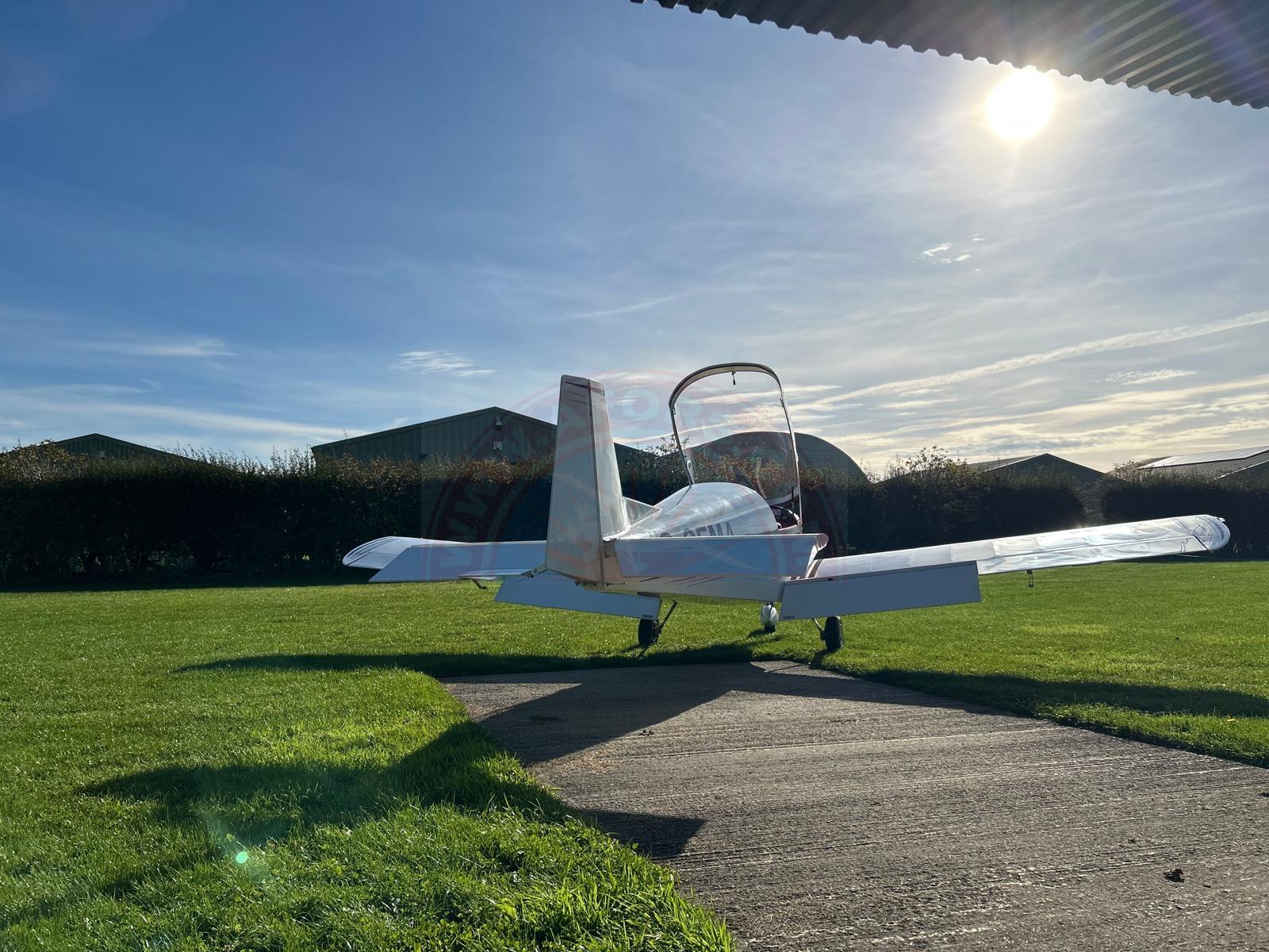 The sun shines on the mountains and trees (by Adam Kool on Unsplash)