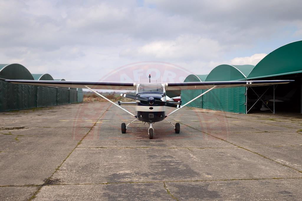 The sun shines on the mountains and trees (by Adam Kool on Unsplash)