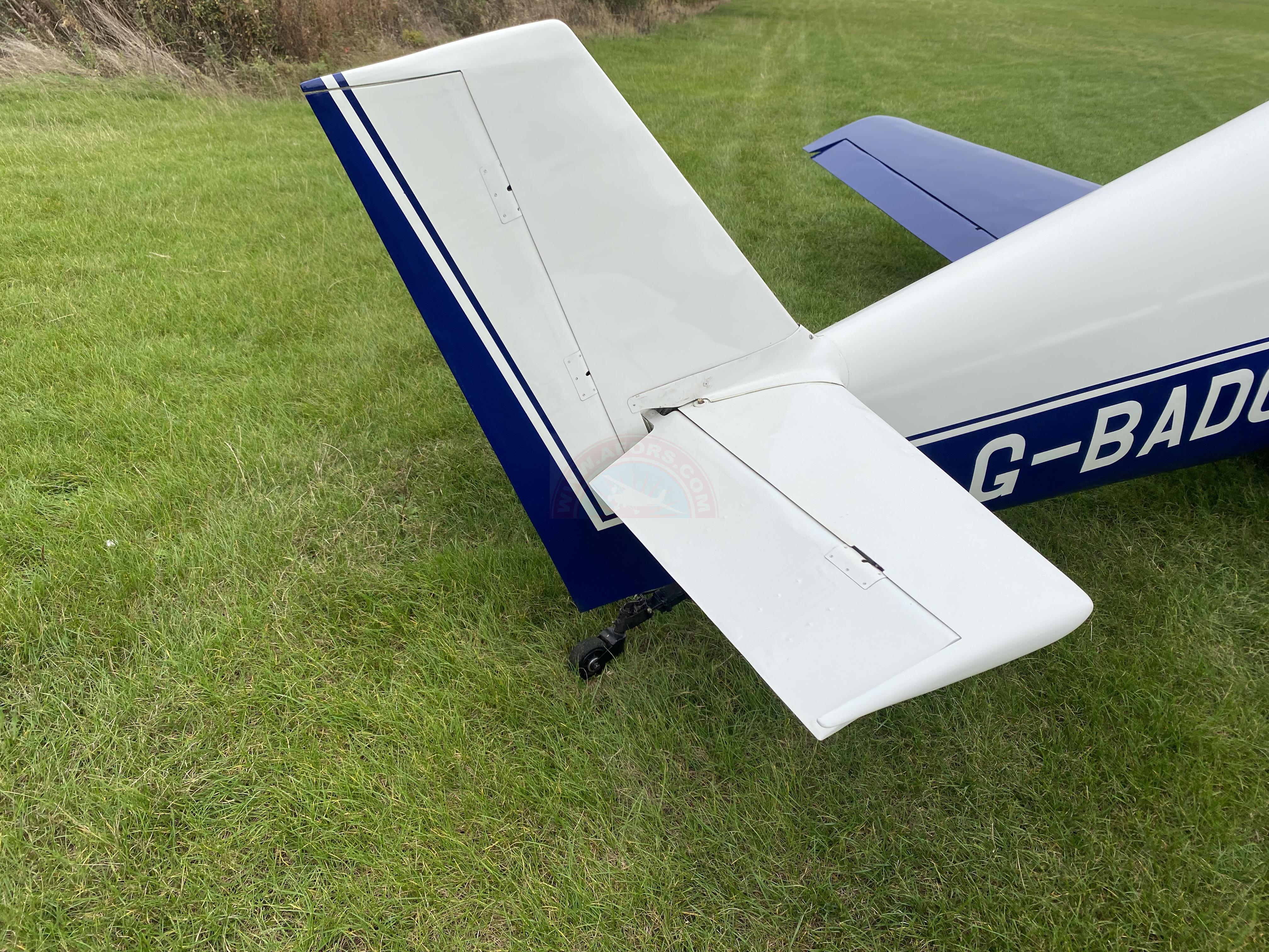 The sun shines on the mountains and trees (by Adam Kool on Unsplash)