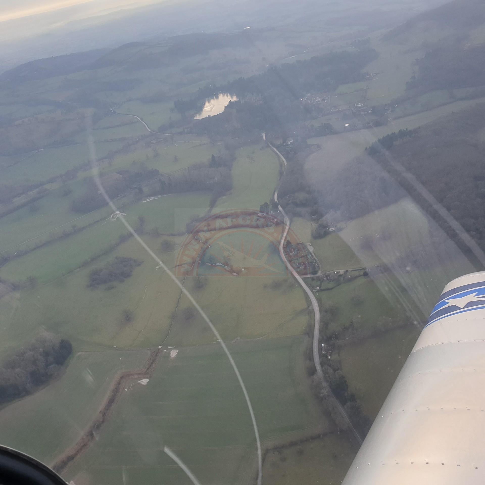 The sun shines on the mountains and trees (by Adam Kool on Unsplash)