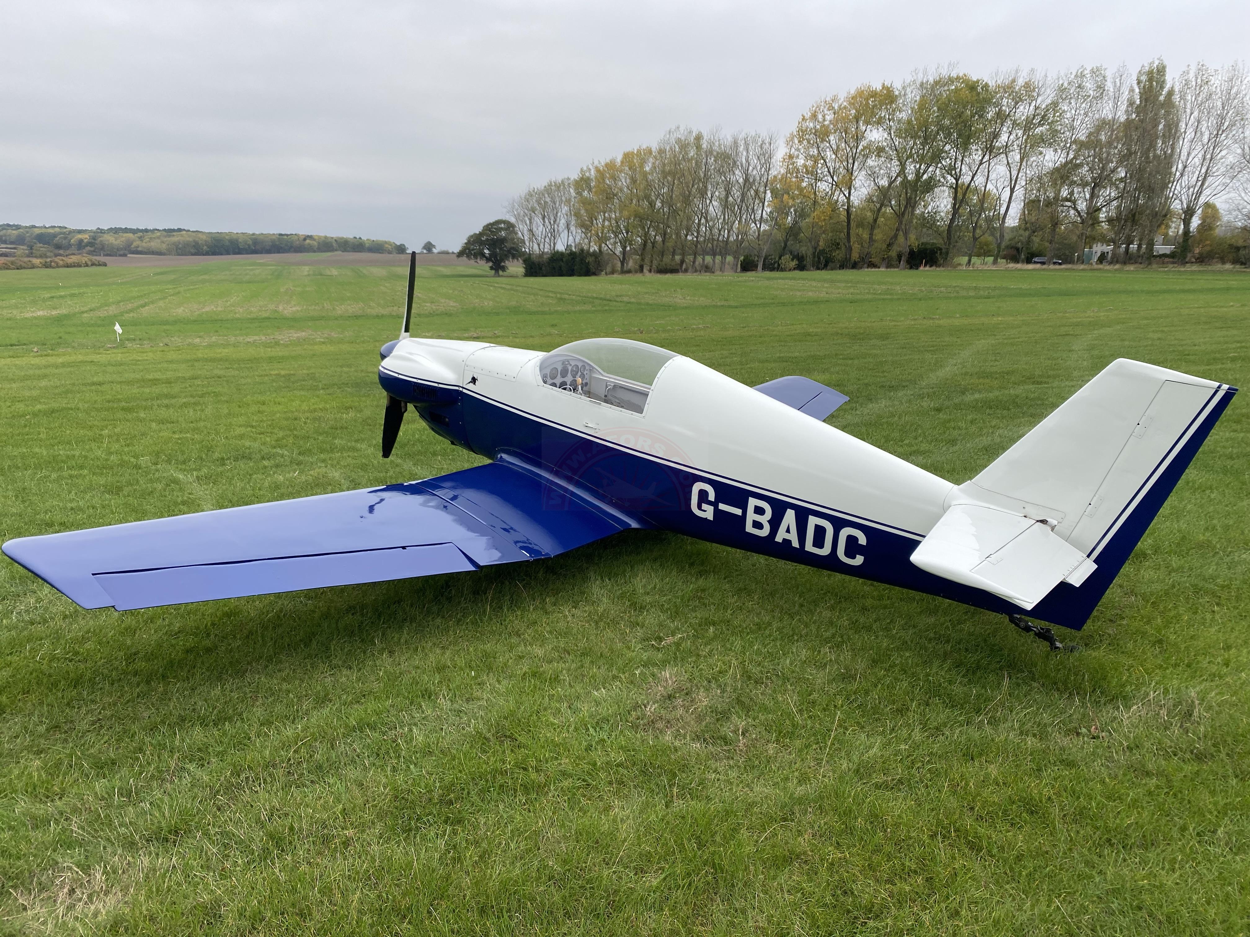 The sun shines on the mountains and trees (by Adam Kool on Unsplash)